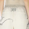 Pantaloni scurți cu imprimeu multi-tatuaj Pantaloni scurți cu imprimeu multi-tatuaj