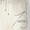 Pantaloni scurți cu imprimeu multi-tatuaj Pantaloni scurți cu imprimeu multi-tatuaj